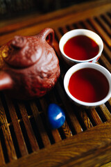 Red Chinese teapot in the form of a handmade dragon