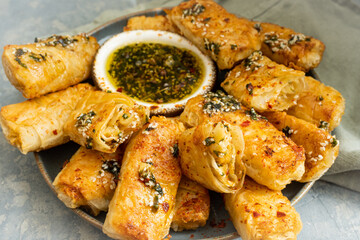 Over fried potato rolls with chili honey