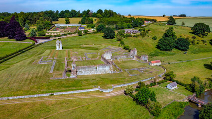 Fototapeta na wymiar Aerial view of the ruins of Kirkham Priory in the Ryedale District of North Yorkshire, England. The ruins of Kirkham Priory are situated on the banks of the River Derwent and dates from 1120AD.