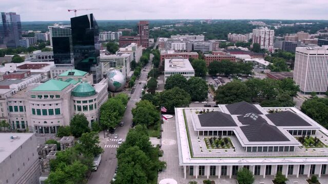 Drone shot of downtown Raleigh with the state legislature building in the foreground