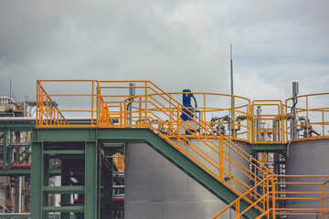 Modern tank chemistry factory with large stairway tanks