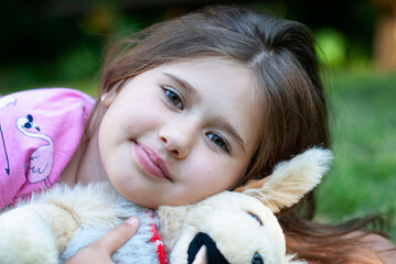 Portrait of Beautiful little girl with toy