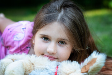 Portrait of Beautiful little girl with toy