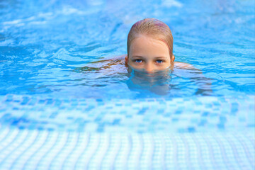 girl with beautiful eyes in the pool. 