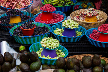 Mexican street market displays colorful beans and a lot of fresh avocados in San Cristobal de las...