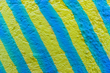 abstract spray graffiti art drawing on street city wall, texture of urban paint culture for design background