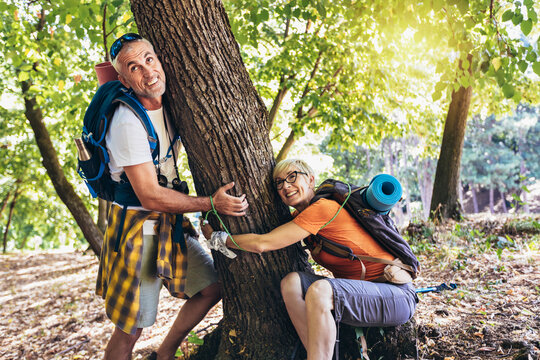 Environmental activists tied to a tree in the forest. Concept save the forest. - Powered by Adobe