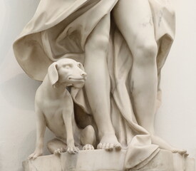 Historic Marble Statue Detail with a Dog in a Canal House in Amsterdam, Netherlands