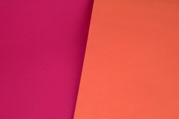 Dark vs light abstract Background with plain subtle smooth de saturated pink orange peach colours...
