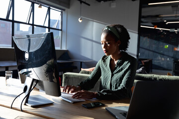African american young businesswoman using computer in office