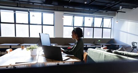 African american young businesswoman working at computer desk in office © wavebreak3