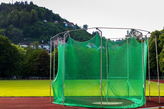 Empty disk throwing training arena in a stadium.