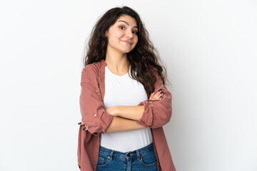 Teenager Russian girl isolated on white background making doubts gesture while lifting the shoulders