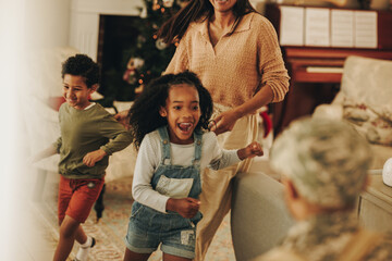 Ecstatic children running to welcome their dad from the army