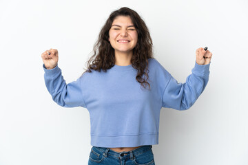 Teenager Russian girl isolated on white background doing strong gesture