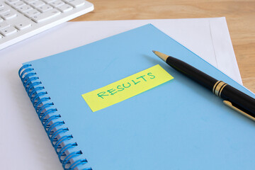 notebook with sticky note paper with message result , business result concept  