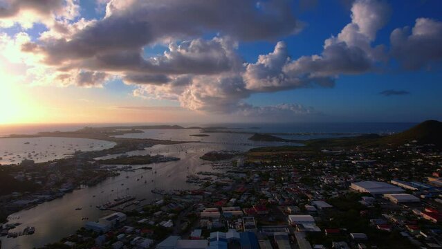 Dramatic sunset view of Simpson bay lagoon on Sint Maarten - Aerial Pullback