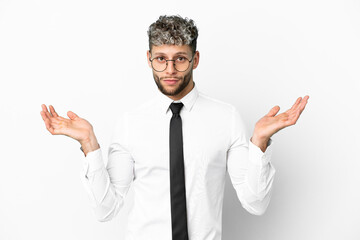 Business caucasian man isolated on white background having doubts while raising hands