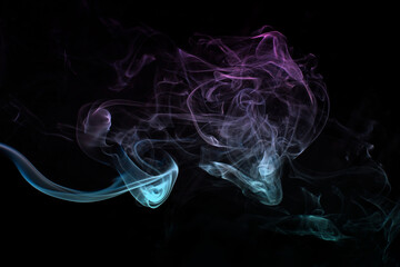 Multicolored smoke for aromatherapy relaxation on black background, beautiful swirled puffs of smoke