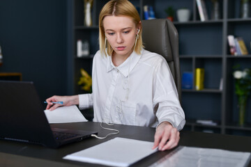 Woman doing paperwork in office