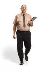 Full length portrait of a security officer holding a clipboard and walking towards camera