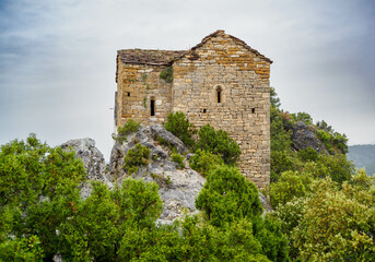 Romanesque hermitage of Santa Quiteria and San Bonifacio over Canelles reservoir , Catalonia, Spain.