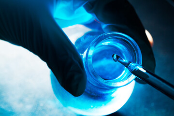 blue glass tube science experiment,Vacutainer or test tube in lab on table - obrazy, fototapety, plakaty
