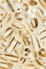 iced coffee texture and ice cubes,Close-up of Cold latte drink with ice cubes
