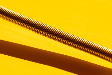 metal tool with hard shadow and yellow tones - 514239525