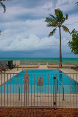View of the hotel pool and ocean at a tropical hotel in Key West, Florida