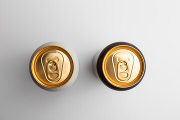 beer cans with gilded tops, top view