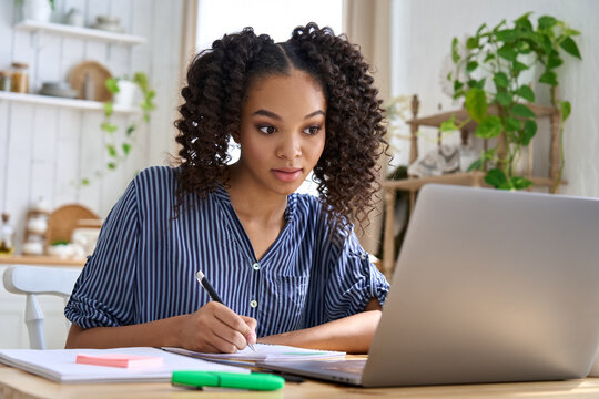 African American Teen Girl School Or College Student Elearning Distance Virtual Class, Watching Online Education Webinar Using Laptop Computer. Remote Studies At Home Concept.