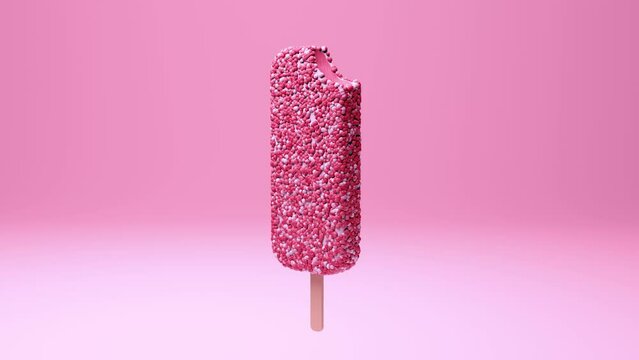 ice cream with strawberry shortcake crumb coating rotating close-up above a pink background. popsicle on a stick