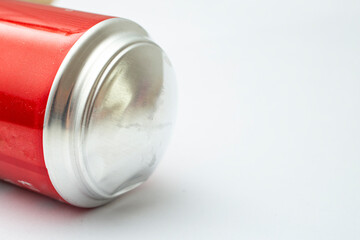 Bulging soda can bottom, isolated on white background, close up