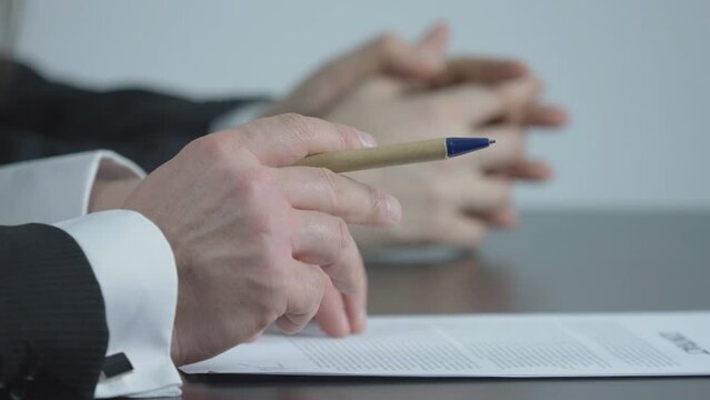 Detail of group hands at office desk, teamwork negotiation