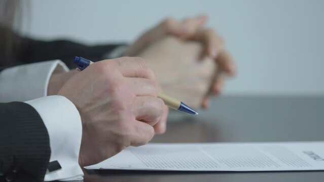 Detail of hands at office desk, lawyer teamwork