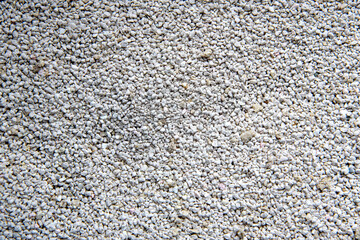 Close up, top down view of bentonite cat litter toilet sand. Macro texture background
