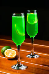 Green cocktail with vermouth, mint and citrus