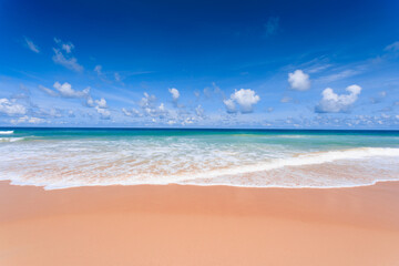 Fototapeta na wymiar Travel background, white sand with blue sky in the summer season, at Karon Beach Phuket, Thailand