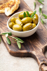 Green olives on gray background.