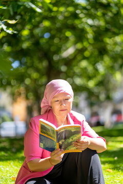 Woman Sick With Cancer Reading A Book To Be Relaxed