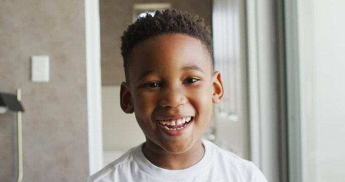 Video of african american boy smiling at camera