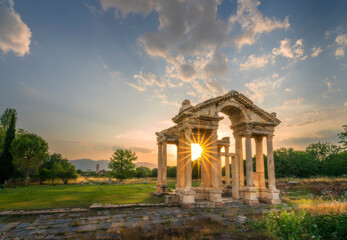 Fototapeta na wymiar Ancient city of Aphrodisias. (Aphrodisias). Sunset through the columns of the Tphrodisias Tetrapyhlon