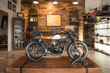 customised motorcycle parked inside custom shop in Bangkok