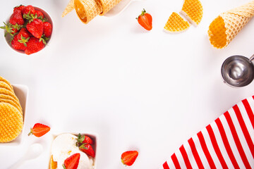 Fresh sweet ice cream with strawberries, waffles, cones. Summer food concept.