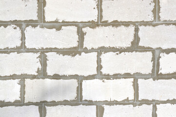 Old brick wall. Ancient stone texture background. Urban background, white ruined industrial brick wall with copy space. Home and office design backdrop. Vintage effect. 