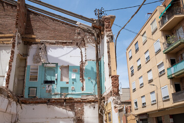 Demolition of old house reveals rooms on different floors, real estate speculation