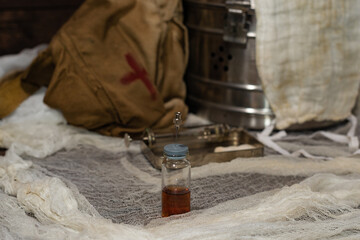 Vial with a vaccine for injection against the background of a medical hospital. Retro medecine