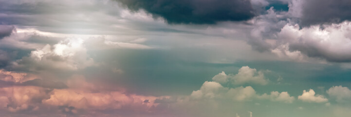 Dramatic sky with dark clouds over a field