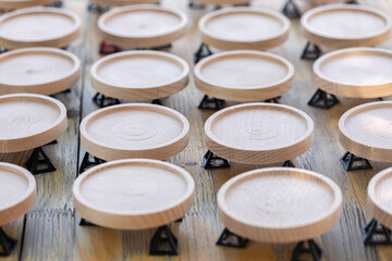 Wooden coasters prepared for painting on the wooden table